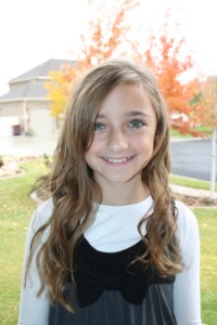 Portrait of young girl modeling Beachy Curls