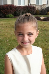 Portrait of young girl modeling Knotted Braid hairstyle