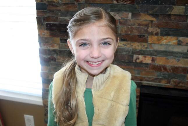 Portrait of young girl modeling the Layered Ponytail