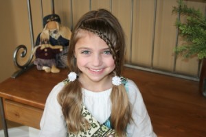 Portrait of young girl modeling the Lace Braid into Soft Ponytails