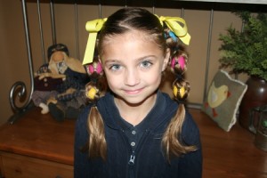 Portrait view of young girl modeling the Egg Tails hairstyle | Easter Pigtails