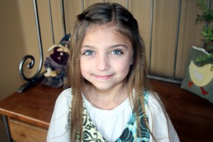 Portrait of young girl modeling the Waterfall Braid Hairstyle with Crimps