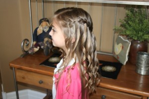 Side left view of the Waterfall Braid Hairstyle with Spiral Curls