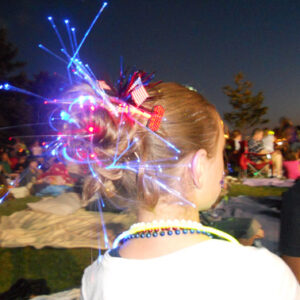 Side back view of the Messy Glow Bun | 4th of July Hairstyles