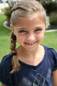 Portrait of young girl modeling the Same-Side Dutch Braid | Cute Hairstyles