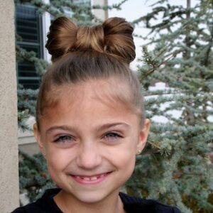 Portrait of young girl modeling the Lady Gaga Bow Hairstyle