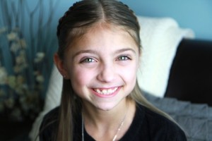 Portrait view of young girl modeling the Lace Braid Heart 