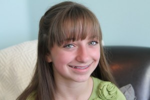 Portrait view of young girl modeling the Waterfall Twist Hairstyle {Front View}