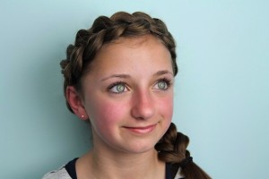 Portrait view of young girl modeling the Wrap-Around Dutch Pancake Braid | Braid Hairstyles