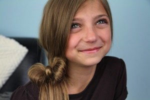 Portrait view of a young girl modeling the Side Ponytail Hair Bow | Cute Hairstyles