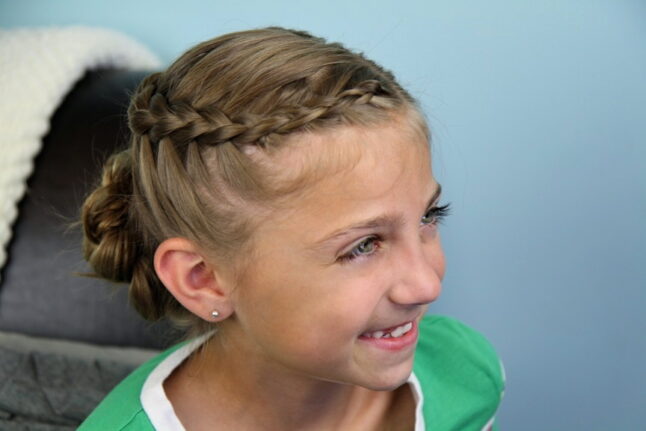 Portrait view of a young girl modeling the Dutch Braided Flower | Updo Hairstyles