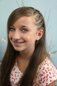 Portrait of a young girl modeling Side Flat Twists | Back-to-School Hairstyles