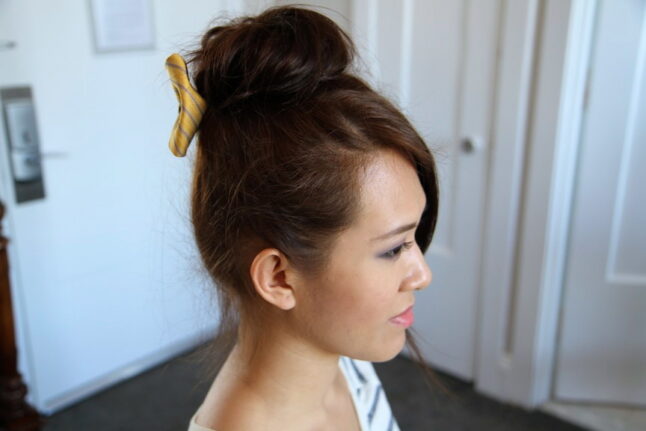 Side view of Teased High Bun Hair Jewelry | Updo Hairstyles | Prom