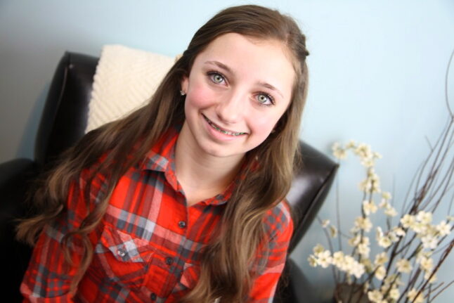 Portrait of a young girl modeling Pancake Lace Braid | Cute Hairstyles