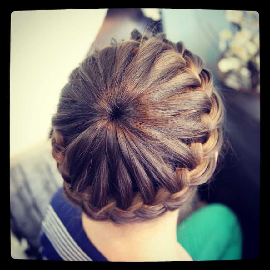 Image of Princess crown braid with a bun hairstyle for 9 year old girls