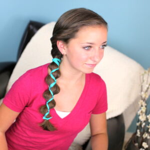 Young girl indoors modeling Ribbon-Accented Loony Braid | Hairstyle Ideas