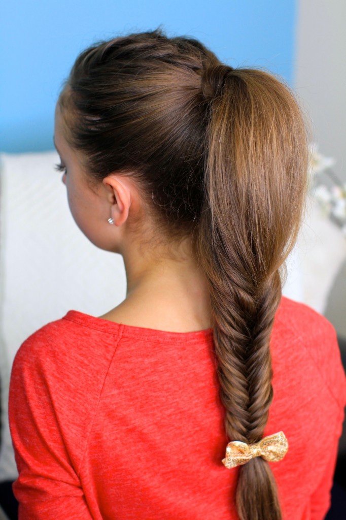 Back view of young girl wearing a red shirt modeling Fluffy Fishtail Braid | Hairstyles for Long Hair