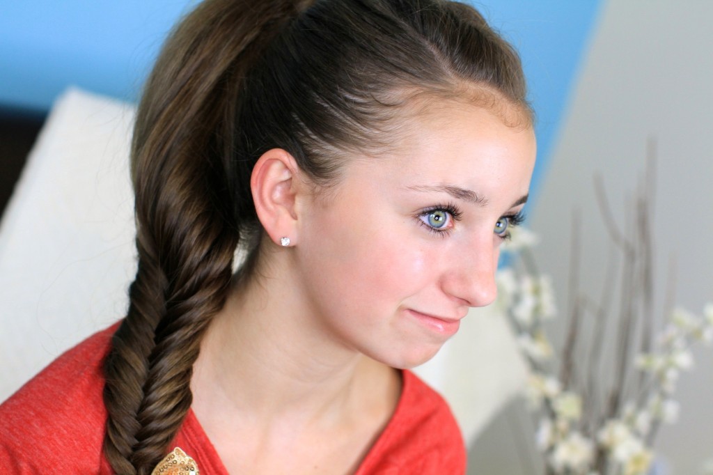 Portrait of young girl wearing a red shirt modeling Fluffy Fishtail Braid | Hairstyles for Long Hair