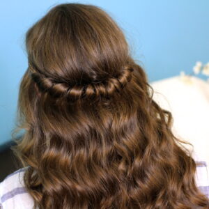 Back view of young girl indoors modeling Headband Twist | Half-Up Half Down Hairstyles