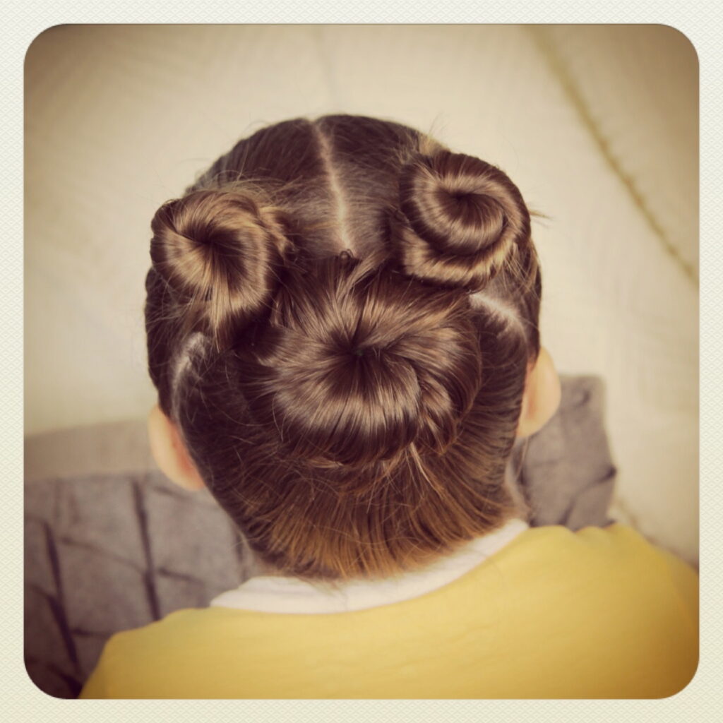Back view of little girl modeling Not-So-Hidden-Mickey | Disney Hairstyles