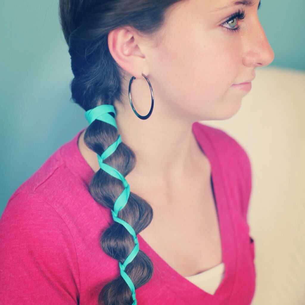 Young girl indoors modeling Ribbon-Accented Loony Braid | Hairstyle Ideas