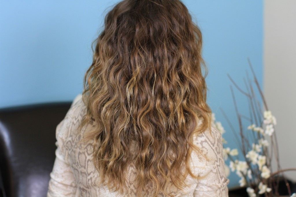 (Back) Woman indoors modeling Deep Waves | Curly Hairstyles