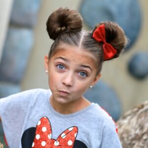 Portrait of a young girl outside modeling Minnie Mouse Buns | Hairstyle Tutorial