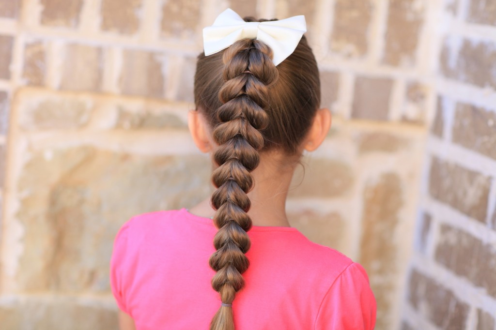 (Back) Young girl outside modeling Pull-Through Braid | Easy Hairstyles