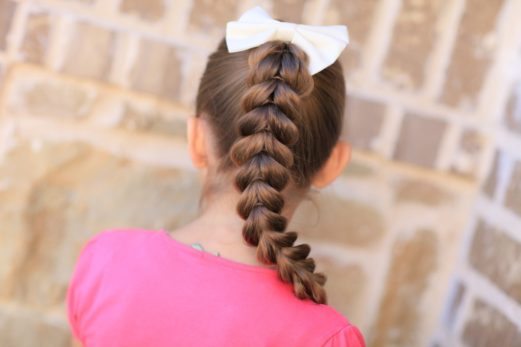 (Back) Young girl outside modeling Pull-Through Braid | Easy Hairstyles