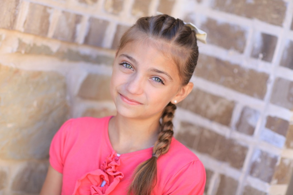 Portrait of young girl outside modeling Pull-Through Braid | Cute Braids