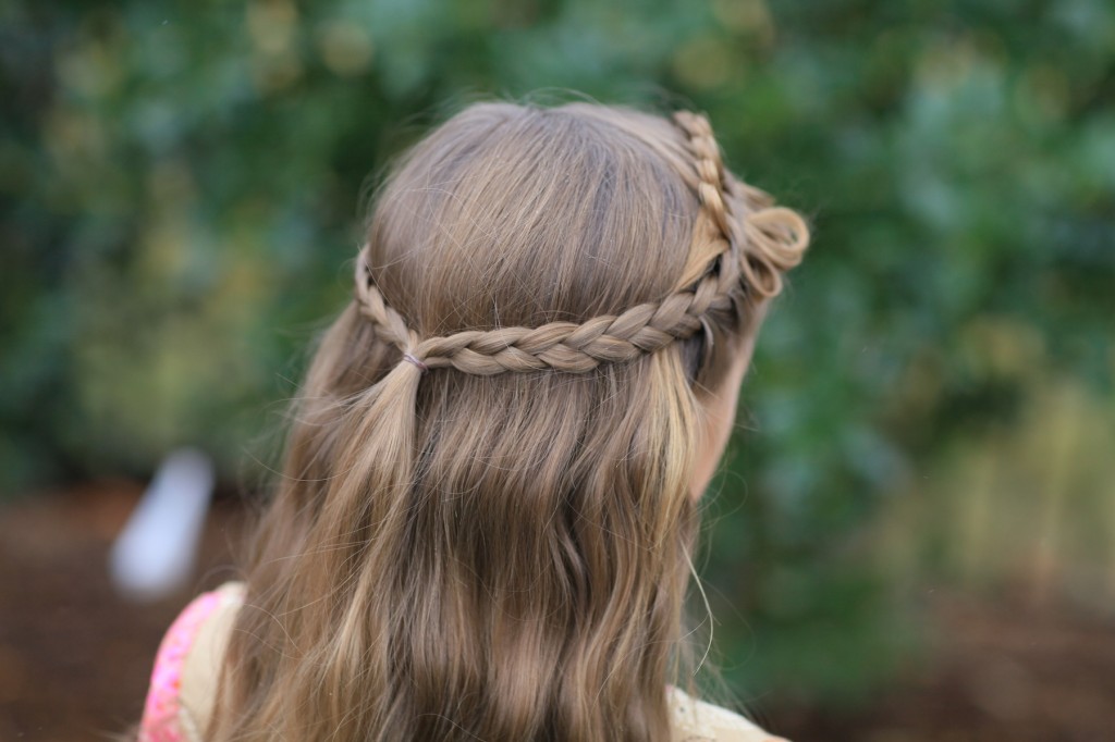 (Back) Young girl outside modeling Prim Bow Braid Tieback | Catching Fire | The Hunger Games