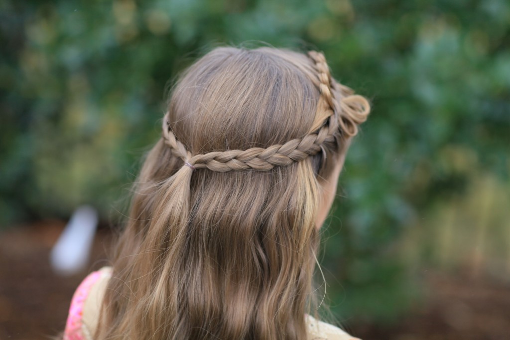 (Back) Young girl outside modeling Prim Bow Braid Tieback | Catching Fire | The Hunger Games