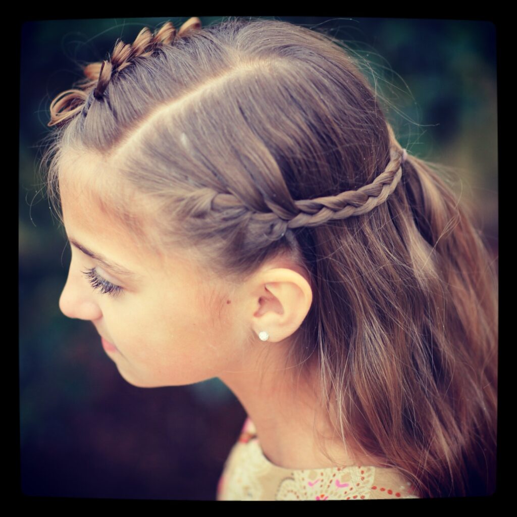 Young girl outside modeling Prim Bow Braid Tieback | Catching Fire | The Hunger Games