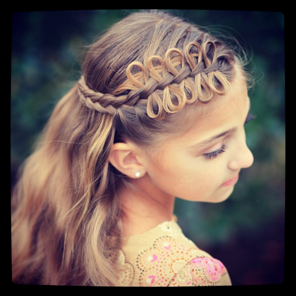 Young girl outside modeling Prim Bow Braid Tieback | Catching Fire | The Hunger Games