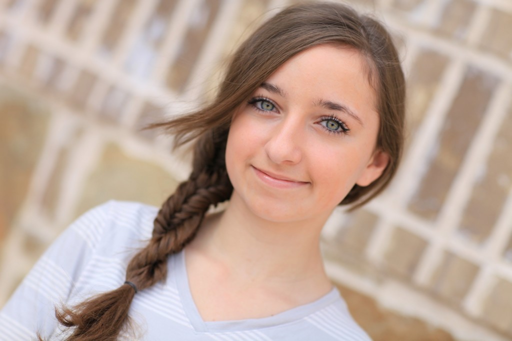 Portrait of a young girl outside modeling Double Fishtail Twist | Braid Hairstyles