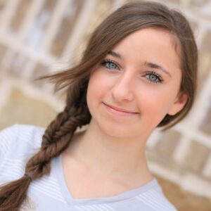 Portrait of a young girl outside modeling Double Fishtail Twist | Braid Hairstyles