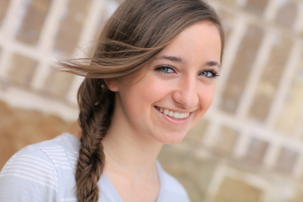 Portrait of a young girl outside modeling Double Fishtail Twist | Braid Hairstyles