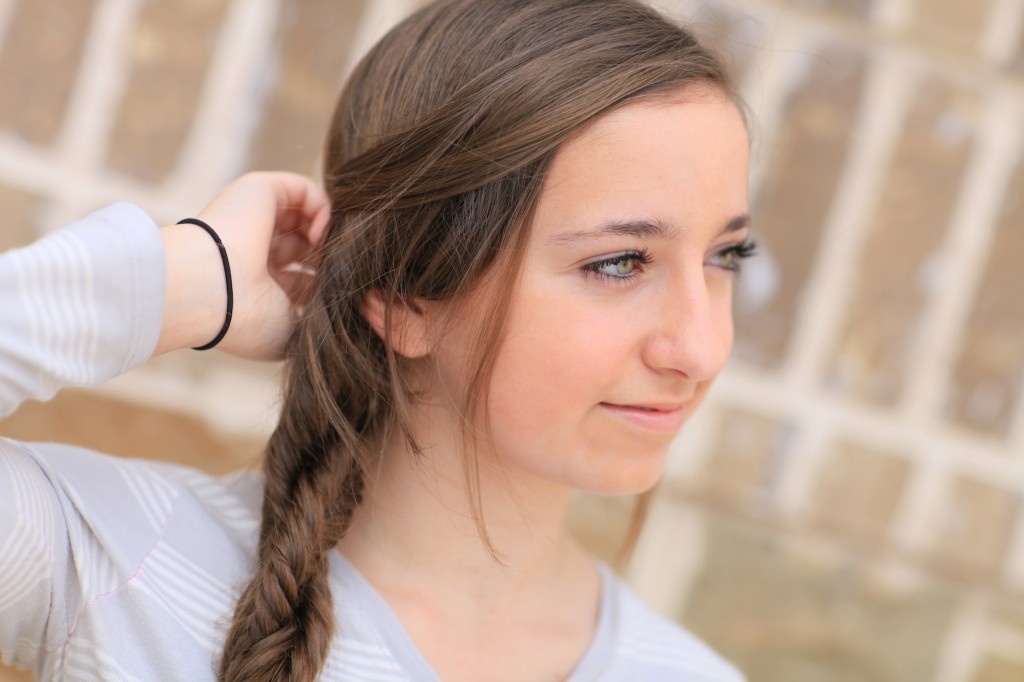 Portrait of a young girl outside modeling Double Fishtail Twist | Braid Hairstyles