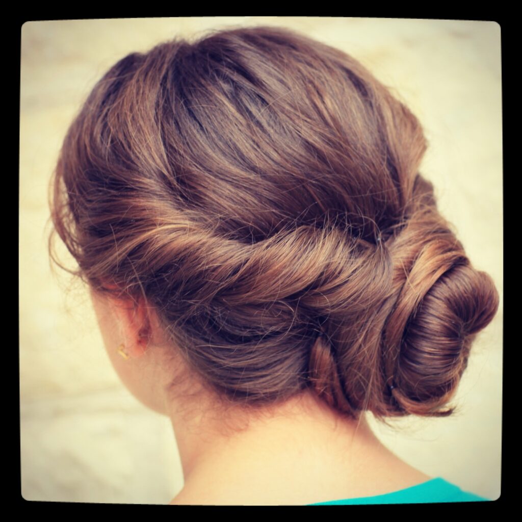 (Back) Young girl outside modeling Easy Twist Updo | Prom Hairstyles 