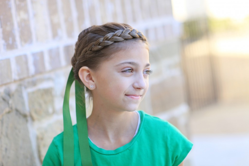 Portrait of young girl modeling Disney Frozen inspired Anna's Coronation Hairstyle 