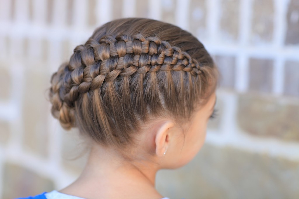 Little girl outside in a blue shirt modeling Zipper Braid | Updo Hairstyles