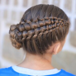 Little girl outside in a blue shirt modeling Zipper Braid | Updo Hairstyles