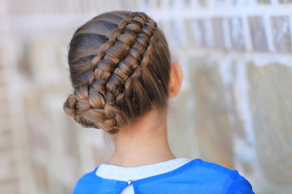 Little girl outside in a blue shirt modeling Zipper Braid | Updo Hairstyles