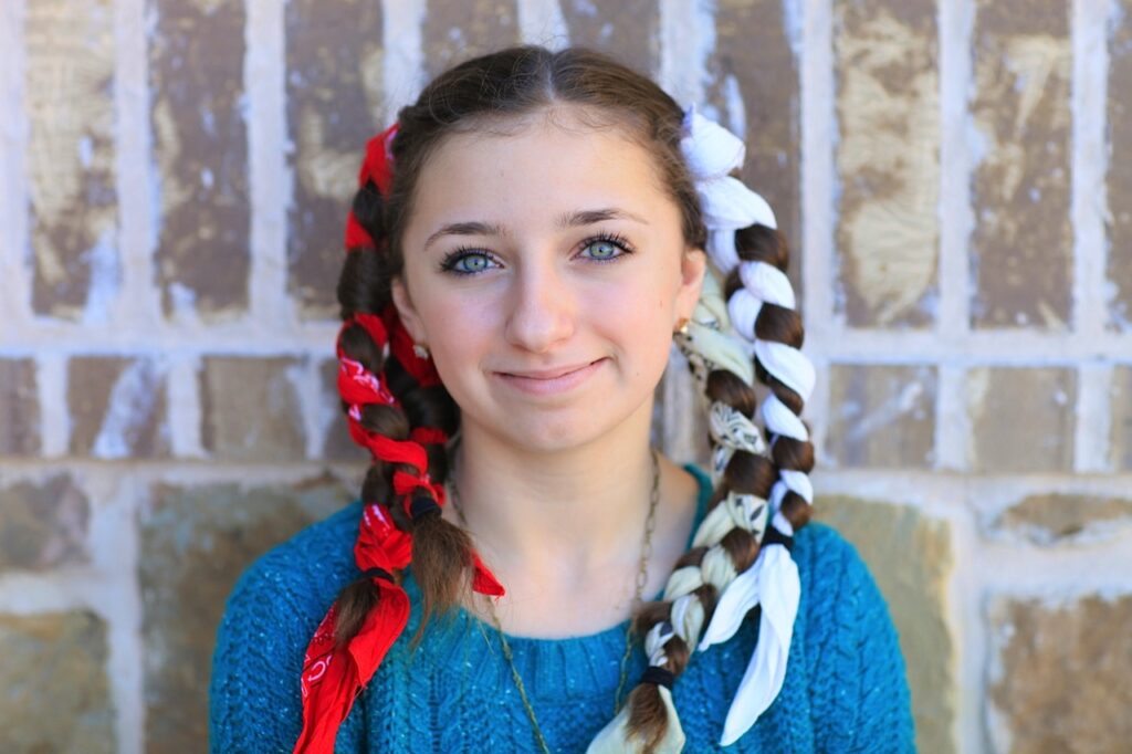 Young girl with red and white bandanas wrapped in her hair | No-Heat Curl Hairstyles