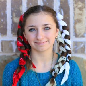 Young girl with red and white bandanas wrapped in her hair | No-Heat Curl Hairstyles