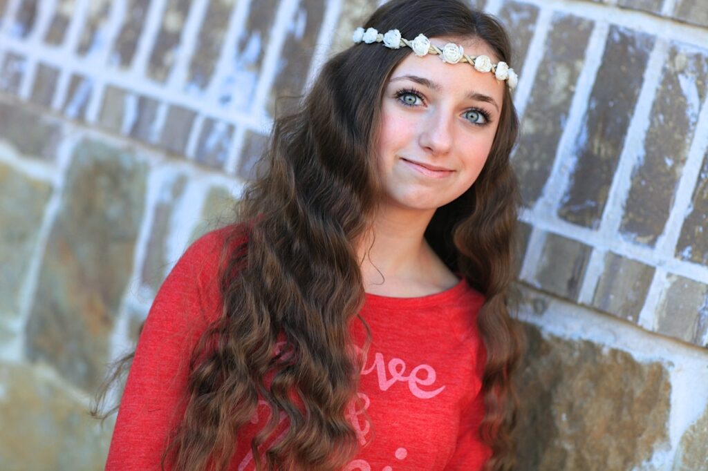 Young girl outside modeling No-Heat Bandana Curls