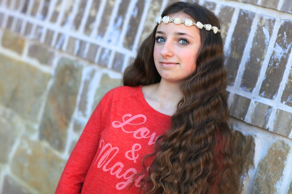 Young girl outside modeling No-Heat Bandana Curls