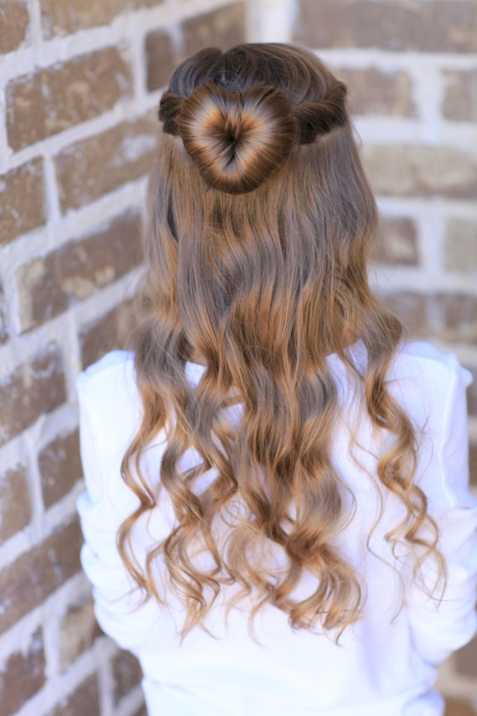 Young girl outside modeling Love Bun | Valentine's Day Hairstyles