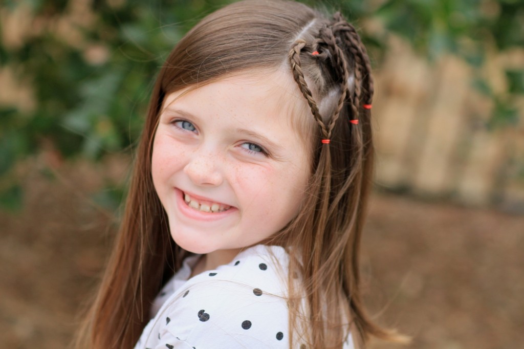 Young girl outside modeling Triple Braided Heart | Valentine's Day Hairstyles