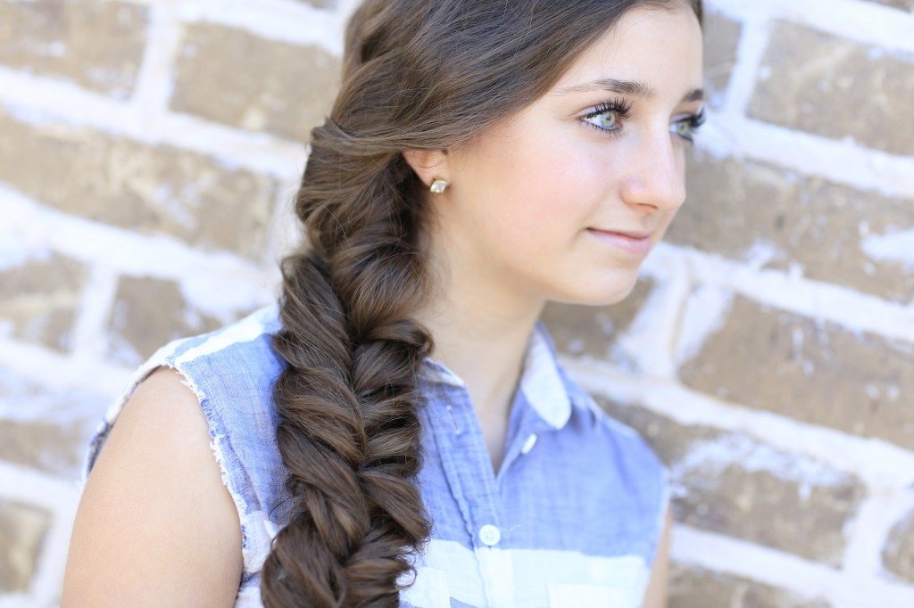 Young woman standing outside modeling Alternative Braid